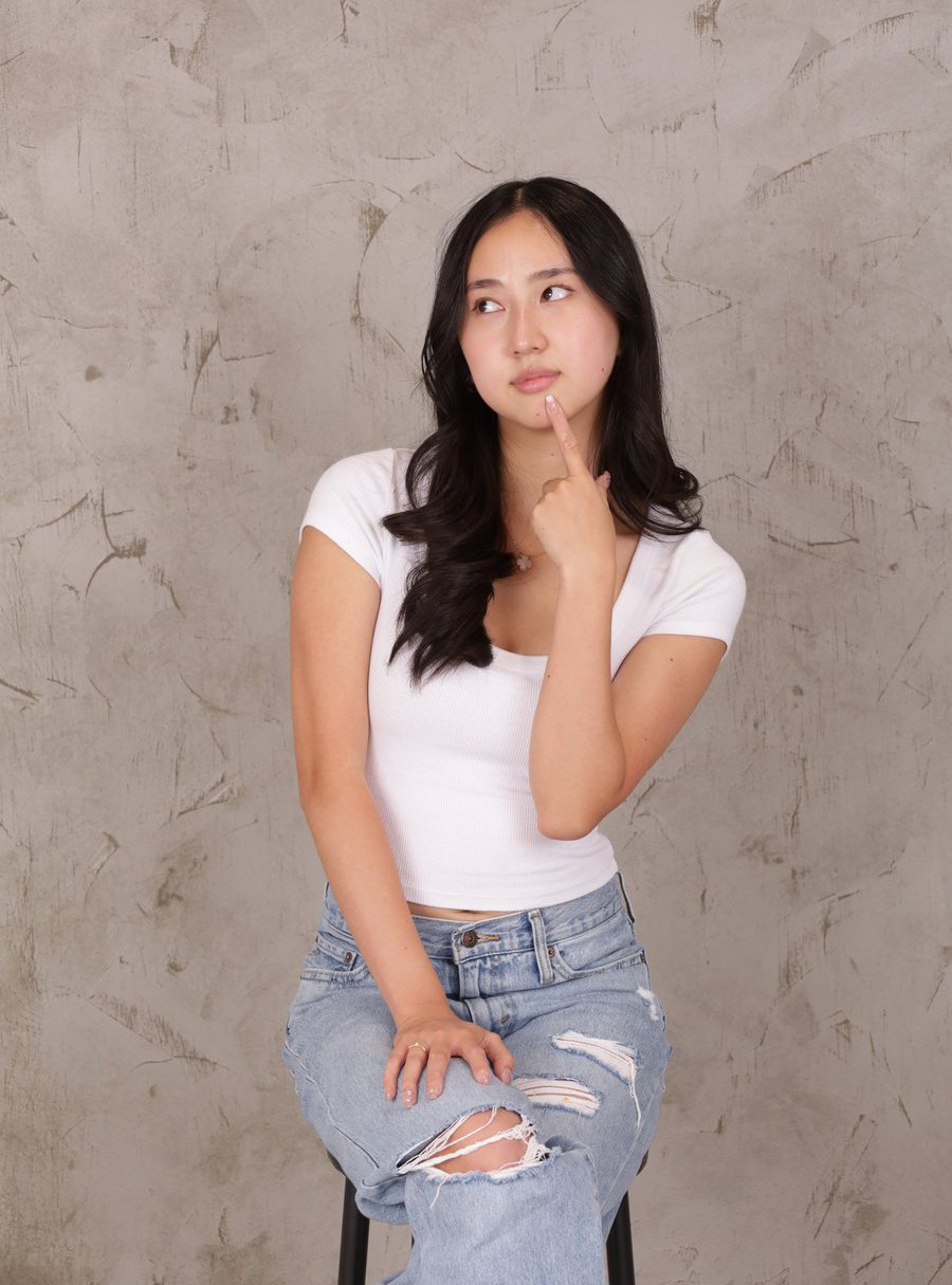 Kimi Nguyen seated, arms crossed